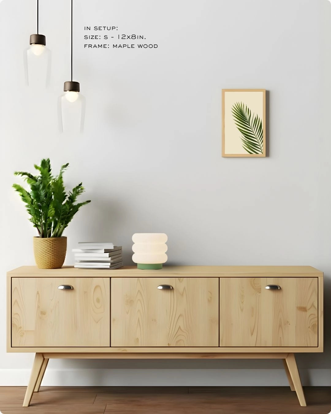 Small accent palm leaf wall art in a Maple Wood frame by K2C Co., featured in a minimalist home decor mockup to demonstrate small-space styling.