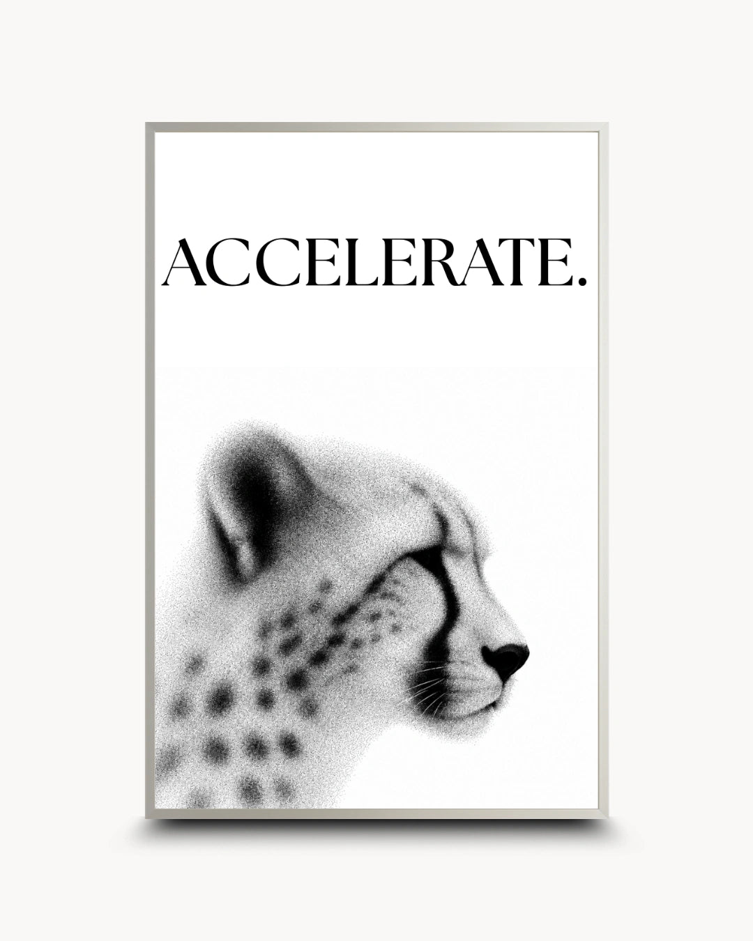 A framed wall art print featuring the word 'ACCELERATE.' above a black-and-white side profile of a cheetah, shown against a light neutral background.