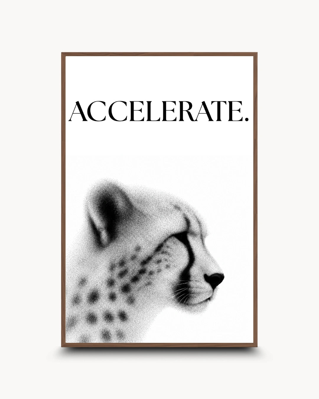 A framed wall art print featuring the word 'ACCELERATE.' above a black-and-white side profile of a cheetah, shown against a light neutral background.