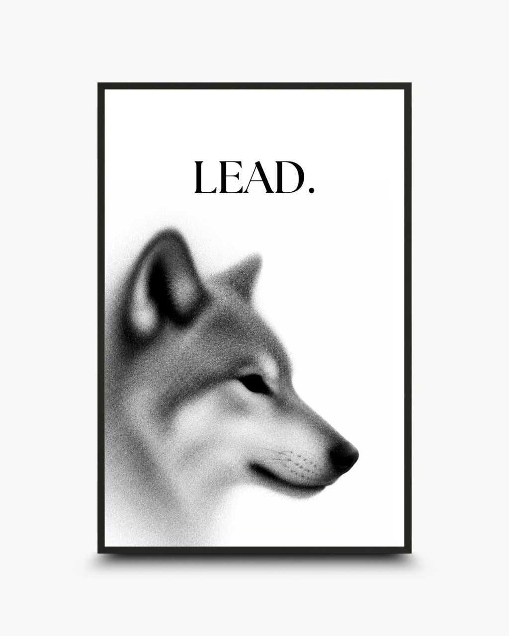 A framed black and white art print featuring a stylized dog head profile with the word 'LEAD.' above it, shown against a light neutral background.