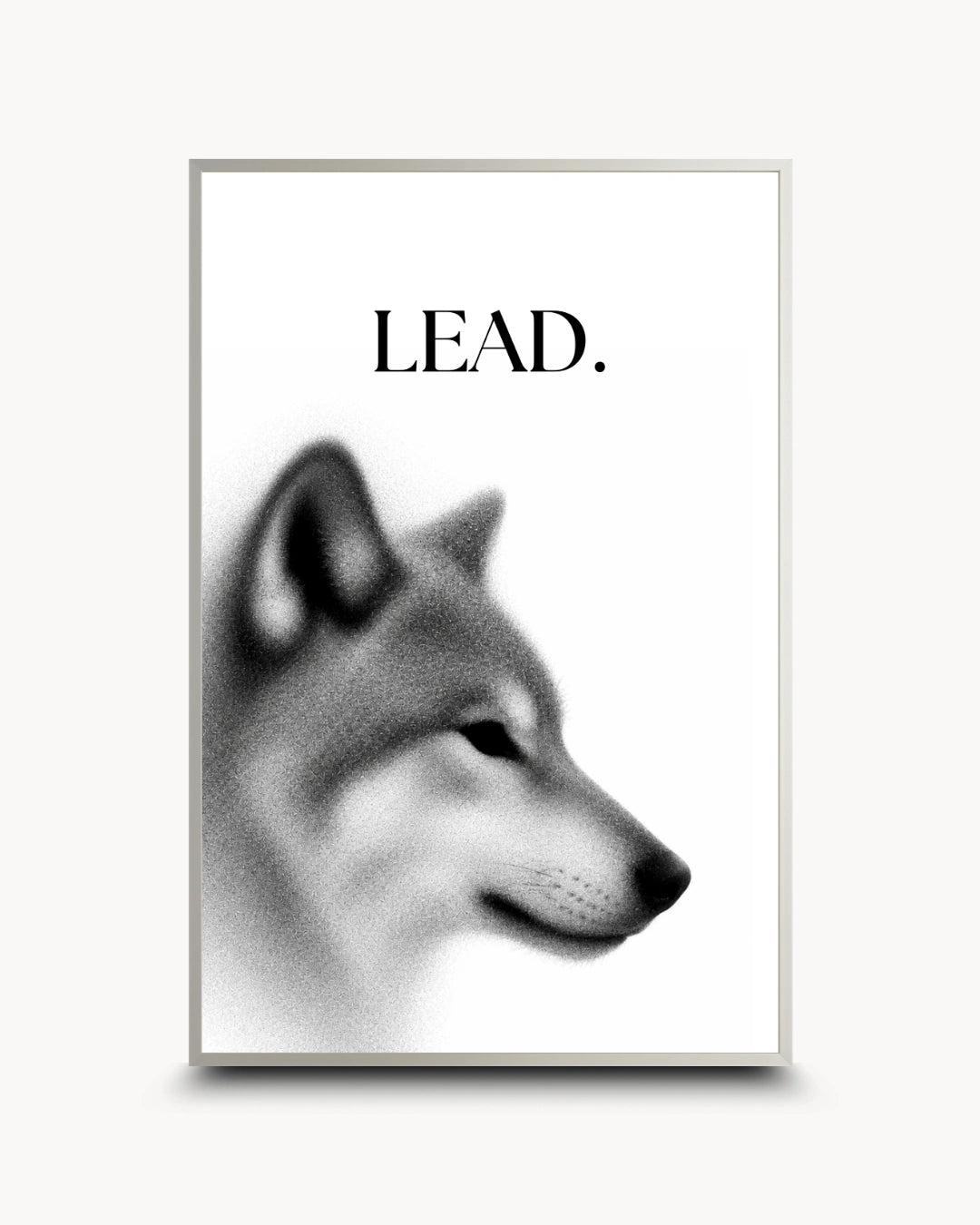 A minimalist framed poster featuring a grayscale wolf head profile with the word 'LEAD.' printed above it, shown against a light neutral background.